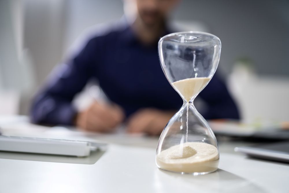 Hourglass focus with man working in the background