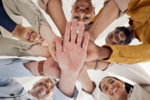 Trust in eDiscovery Project Management: Team with Hands Stacked